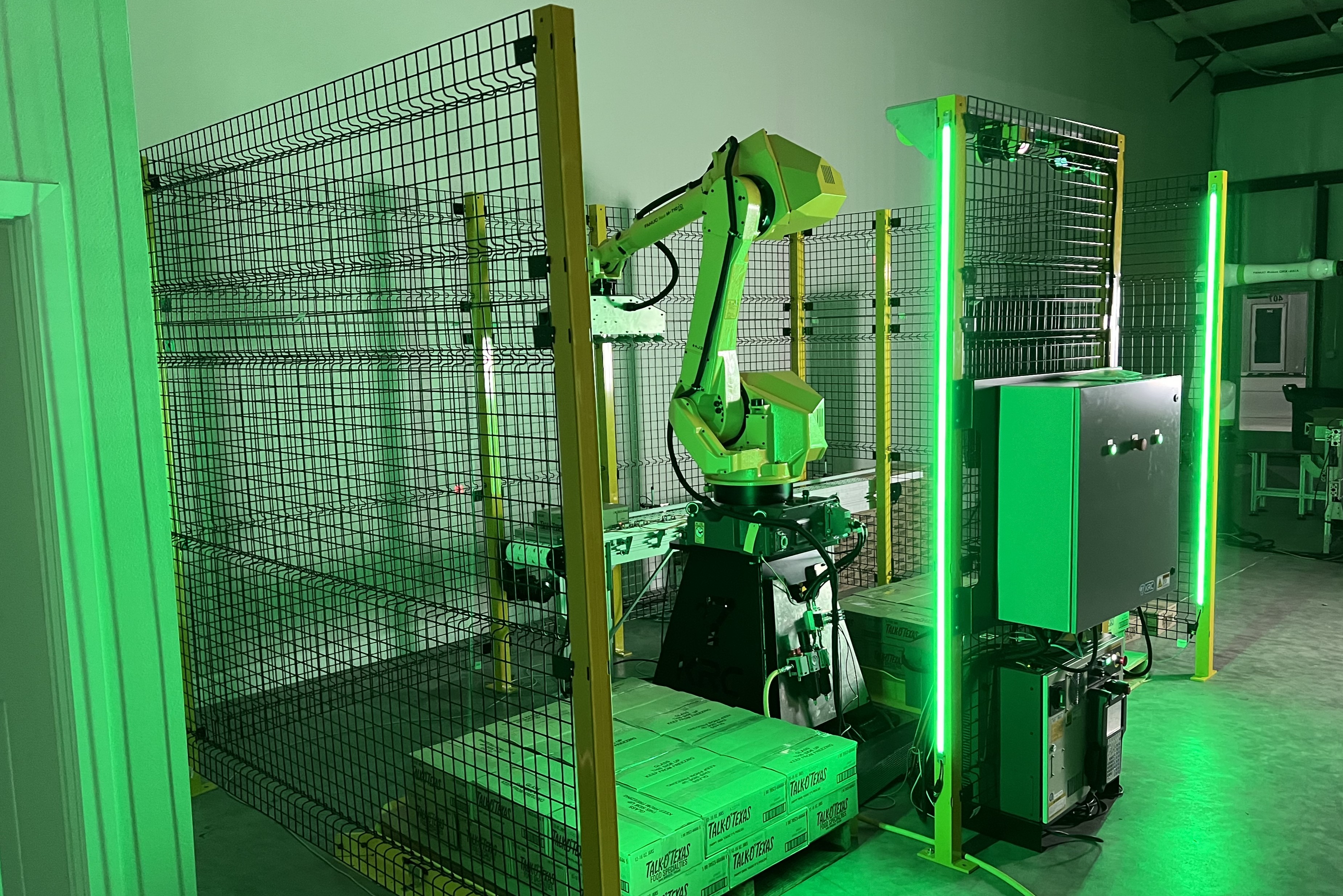 KRC FANUC robot palletizer cell - complete turnkey automation system built by Kurtin Robotics